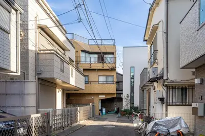 an alleyway between two buildings in a city at Marble TOKYO Base Tabata 301 in Tokyo