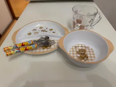 a table with two plates and a bowl with a teddy bear at Real Japanese Culture Stay Shibamata Near Asakusa in Tokyo