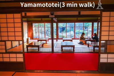 two people sitting in a room with a red floor at Real Japanese Culture Stay Shibamata Near Asakusa in Tokyo