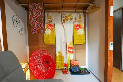 a red umbrella sitting on the floor next to a window at Real Japanese Culture Stay Shibamata Near Asakusa in Tokyo