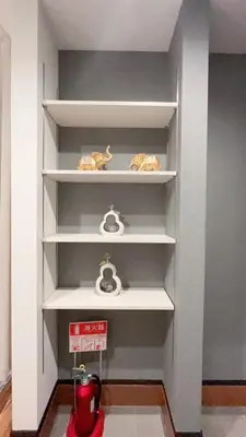a shelf with some knick knacks on it at Tokyo Hoshino House 1Floor in Tokyo