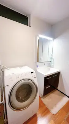 a washing machine in a bathroom with a sink at Tokyo Hoshino House 1Floor in Tokyo