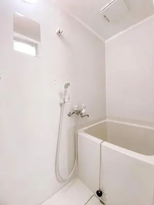a white bathroom with a tub and a shower at 2F TINY Central Apartment 7 minutes from Shinjuku in Tokyo