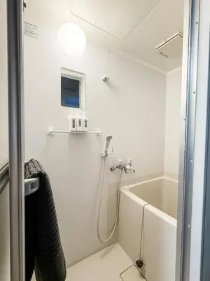 a bathroom with a shower and a bath tub at 2F TINY Central Apartment 7 minutes from Shinjuku in Tokyo
