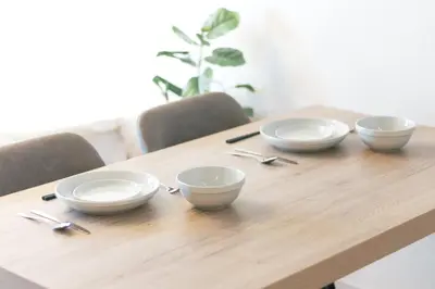 a wooden table with four bowls and spoons on it at 5 min walk to station, New building, 15 m Meguro River in Tokyo
