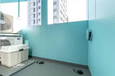 a blue wall in a room with a fax machine at 5 min walk to station, New building, 15 m Meguro River in Tokyo