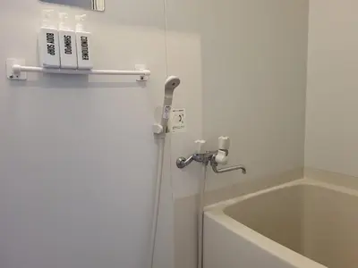 a bathroom with a shower and a tub and a sink at DUPLEX TINY Apartments, 1 Listing Central Near Shinjuku in Tokyo