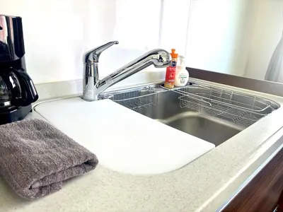 a sink with a white cutting board in it at 2F Spacious Apartment in Shinjuku, Shibuya Tokyo in Tokyo