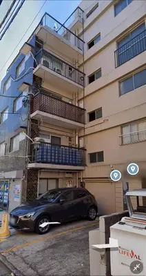 a black car parked in front of a building at 2F Spacious Apartment in Shinjuku, Shibuya Tokyo in Tokyo