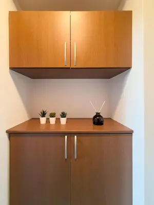 a wooden cabinet with two potted plants on it at ISSHUKU NOMA\u6c60\u888bII 201 - Spacious Room for 5 Guests in Tokyo