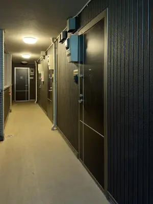 a row of lockers in a hallway in a building at ISSHUKU NOMA\u6c60\u888bII 202 - Quad Room in Tokyo