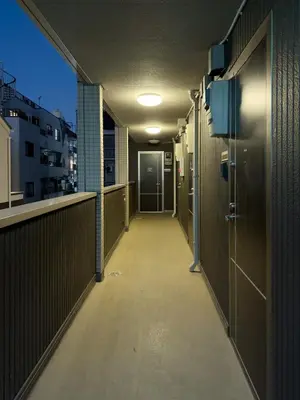 an empty corridor of a building with a walkway at ISSHUKU NOMA\u6c60\u888bII 202 - Quad Room in Tokyo