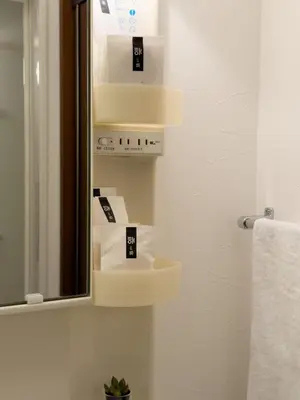 a bathroom with a mirror and some white boxes at ISSHUKU NOMA\u6c60\u888bII 202 - Quad Room in Tokyo