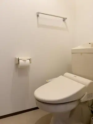 a bathroom with a toilet and a roll of toilet paper at ISSHUKU NOMA\u6c60\u888bII 203 - Quad Room in Tokyo