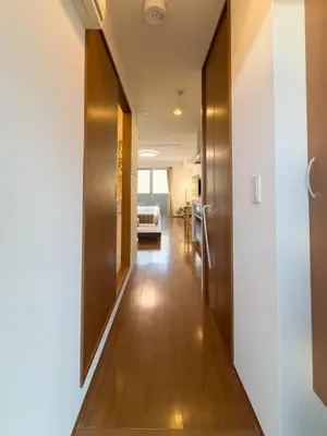 a hallway of a house with wooden floors at ISSHUKU NOMA\u6c60\u888bII 203 - Quad Room in Tokyo