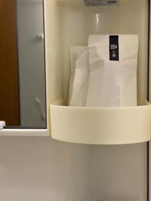 a box of toilet paper in a bathroom with a mirror at ISSHUKU NOMA\u6c60\u888bII 205 - Quad Room in Tokyo