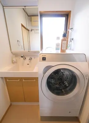 a washing machine in a bathroom with a sink at Urban Hills IKEBUKURO 51sqm Big 1LDK 5people Beautiful Japanese Interior in Tokyo