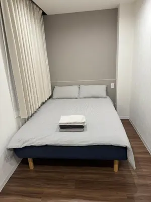 a bed in a small room with a mattress at C&H hotel2F in Tokyo