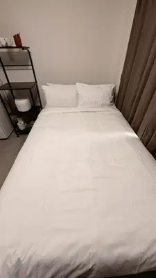 a large white bed in a room at CraftFlat Numabukuro 303, uphill residence in Tokyo