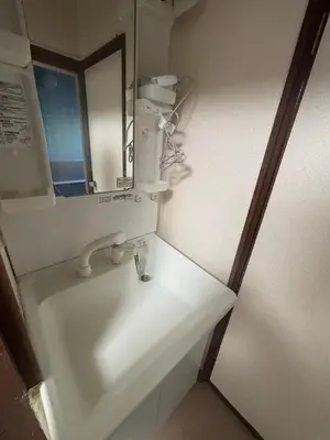 a bathroom with a sink and a mirror at Koenji house in Tokyo