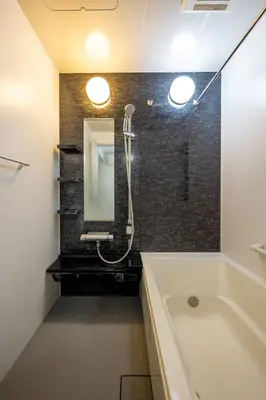 a bathroom with a tub and a sink and a mirror at Haneda Hub 7km to HND- 6min Walk to Omori Stn in Tokyo