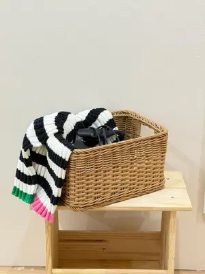 a wicker basket sitting on a wooden table at C&H 5丁目B1ｆ in Tokyo