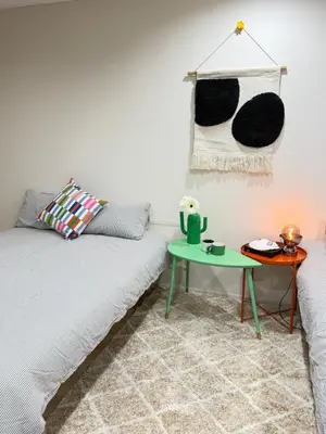 a living room with a couch and a table at C&H 5丁目B1ｆ in Tokyo