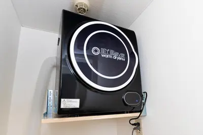 a black and white sign on a shelf in a room at \u30a8\u30c9\u30e2\u30c0\u30f3\u30b9\u30c6\u30a4 Edo Modern Stay 02 in Tokyo