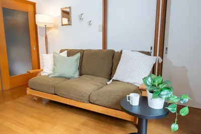 a couch in a living room with a table at Japanese life with garden, 2BR, feel & enjoy seasons in Tokyo