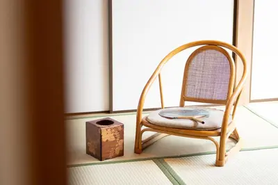 a chair sitting in a room next to a window at Japanese life with garden, 2BR, feel & enjoy seasons in Tokyo