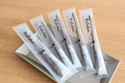 a group of toothbrushes sitting on top of a table at \u30d9\u30eb\u30d3\u30fc\u4eac\u5cf6 Belle Vie Kyoujima in Tokyo