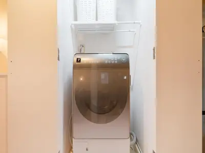 a refrigerator with a washing machine inside of it at Meguro Sta 2 min , Shirokanedai Sta 2 min ,Family & Group Friendly,Switch,Wi-Fi in Tokyo