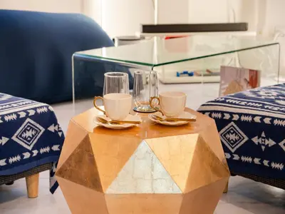 a table with two cups and glasses on top of it at Meguro Sta 2 min , Shirokanedai Sta 2 min ,Family & Group Friendly,Switch,Wi-Fi in Tokyo