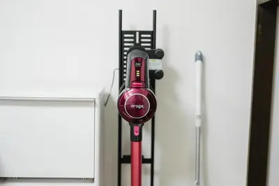 a red cell phone is hanging on a wall at Magome tokyo stay in Tokyo