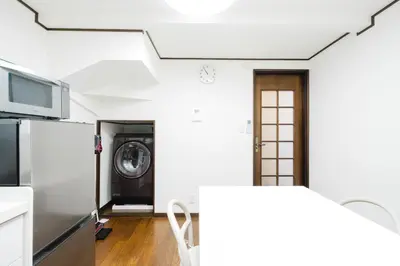 a kitchen with a washer and dryer at Magome tokyo stay in Tokyo