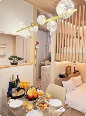 a room with a table with food and drinks on it at Designers apartment Shibuya Shinjuku area in Tokyo