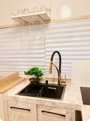 a kitchen with a sink and a counter top at Designers apartment Shibuya Shinjuku area in Tokyo