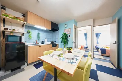 a kitchen and dining room with a table and chairs at Shamrock Aoto 202 Cozy Tokyo Stay Near Station Airport Disney Access in Tokyo