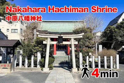 a person walking in front of a shrine at Shamrock Aoto 202 Cozy Tokyo Stay Near Station Airport Disney Access in Tokyo