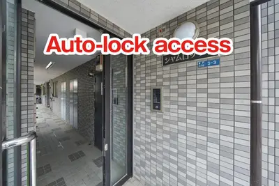 an auto lock access sign on the side of a building at Shamrock Aoto 301 Cozy Tokyo Stay Near Station Airport Disney Access in Tokyo