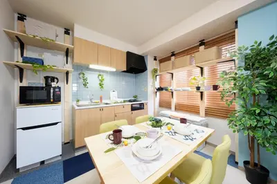 a kitchen with a table and chairs in a room at Shamrock Aoto 301 Cozy Tokyo Stay Near Station Airport Disney Access in Tokyo