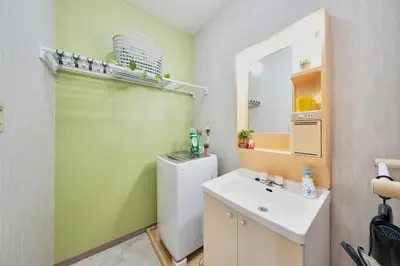 a bathroom with a toilet and a sink and a mirror at Shamrock Aoto 301 Cozy Tokyo Stay Near Station Airport Disney Access in Tokyo