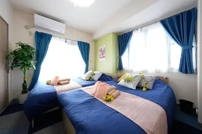 a bedroom with two beds with stuffed animals on them at Shamrock Aoto 301 Cozy Tokyo Stay Near Station Airport Disney Access in Tokyo