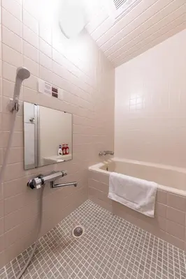 a bathroom with a shower and a tub and a sink at Tourist Hotel New Aoki \u89b3\u5149\u30db\u30c6\u30eb \u30cb\u30e5\u30fc\u9752\u6728 in Tokyo