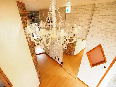 a dining room with a chandelier and a mirror at 301 Koiwa Grand House in Tokyo