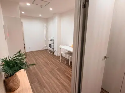 an empty room with a table and a dining room at C&H hotel3F in Tokyo