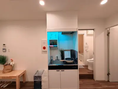 a kitchen with a sink and a counter at C&H hotel3F in Tokyo