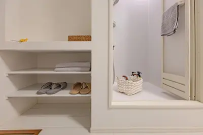a walk in closet with shoes and a purse at Otsuka 7 mins one stop to Ikebukuro mansion with garden in Tokyo