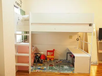 a bunk bed with a toy train on the floor at Koiwa Guesthouse Tokyo in Tokyo