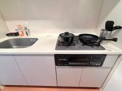 a kitchen stove with two pots and pans on it at Cozy APT Stay in Center Tokyo -SHIBUYA in Tokyo